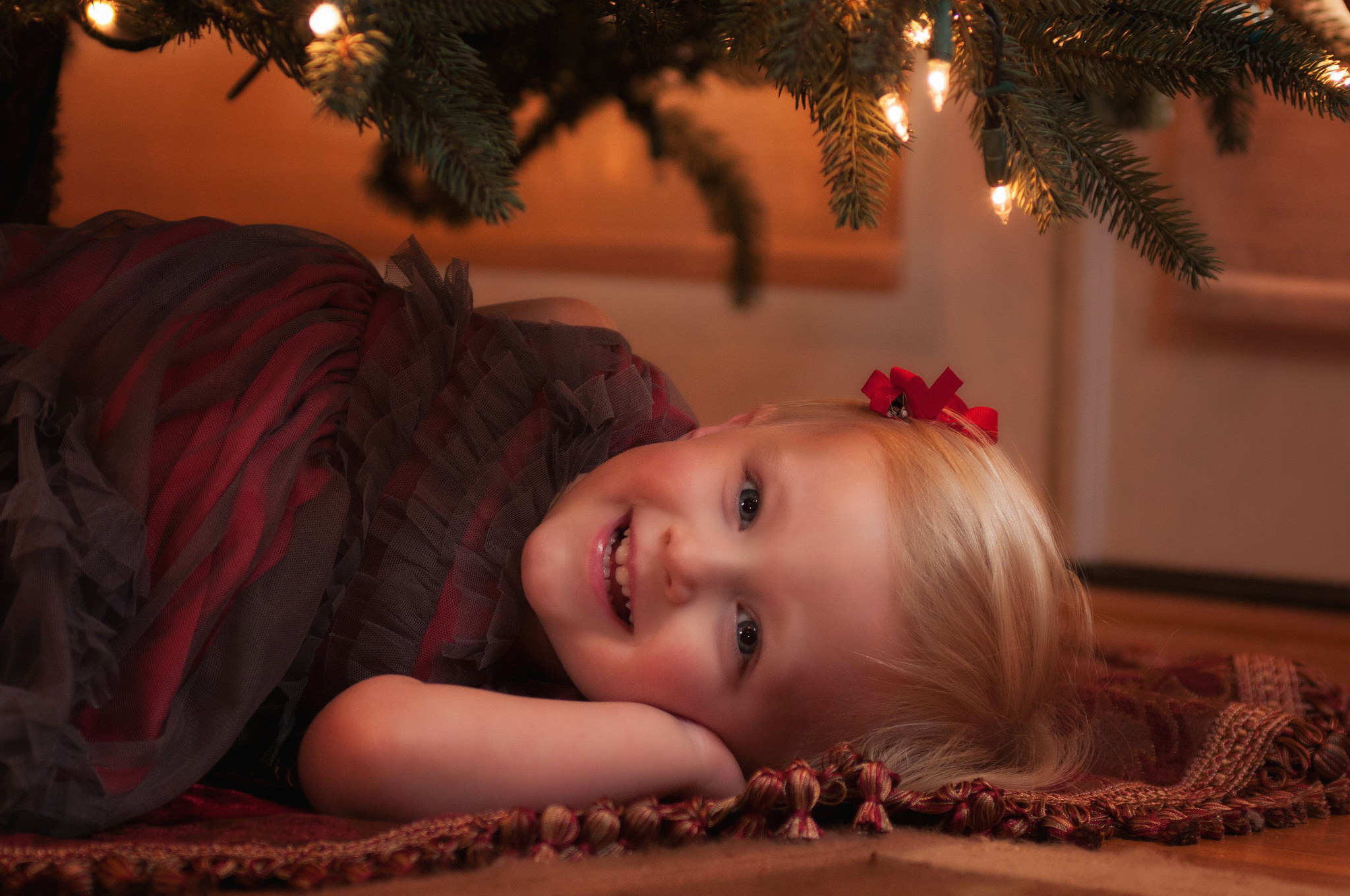 a-child-plays-under-the-christmas-tree a-child-plays-under-the-christmas-tree