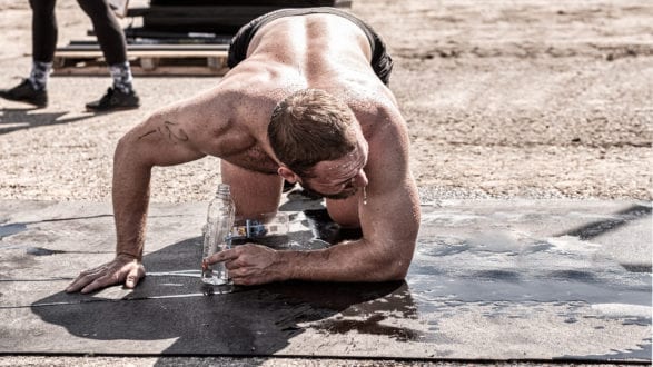 crossFit athlete dripping sweat after a hard workout training WOD
