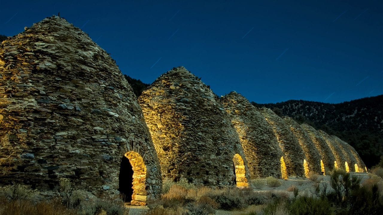 500px Photo ID: 241505653 - The Glow of the Wildrose (8841)

High up in the mountains above the parched sands of Death Valley are the Wildrose Charcoal Kilns, built in 1877. In these arid 8000 ft./2430m mountains, The ten charcoal kilns were built by the Modock Consolidated Mining Company. They were built to provide fuel for two lead/silver smelters––about 25 miles away. These 25-foot tall kilns were used only for a couple of years. And almost 150 years later, one can still smell the burnt charcoal.
~~~~~
I met up with my friend Lance Keimig (National Parks At Night) and a beautiful group of people in DVNP. We went out late nights to photograph the amazing sites. Lance lit the exterior of the kilns with a Luxli Viola LED panel, while Klaus-Peter Statz lit the interior of each kiln with another LED panel. Thanks, and feel free to share!
~~~~~
IG - instagram.com/kenleephotography
FB - fb.com/kenleephotography
Flickr - flickr.com/kenleephotography
500px - 500px.com/kenleephotography
~~~~~
Nikon D610/Nikkor 28-300mm f/2.8 lens @ 8 minutes f/10 ISO 100 
~~~~~
#kenlee  #kenleephotography #lightpainting #longexposure #nightphotography #slowshutter #amazing_longexpo #longexphunter #longexpoelite  #longexposure_shots  #supreme_nightshots  #ig_astrophotography #super_photolongexpo #‎long_exposure‬ #nightscaper  #nightphotography #deathvalley  #wildrosecharcoalkilns #vello #protomachines  #MyRRS #ReallyRightStuff #feisol #Nikon #NPAN #findyourpark #photographylife #photography #photopills #photographyislifee #photoshop #photographylover