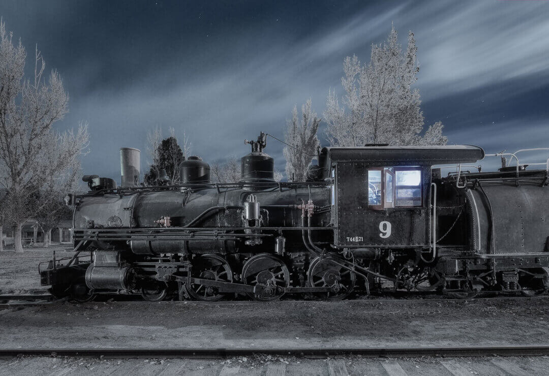 Locomotive train at night with handheld light painting.