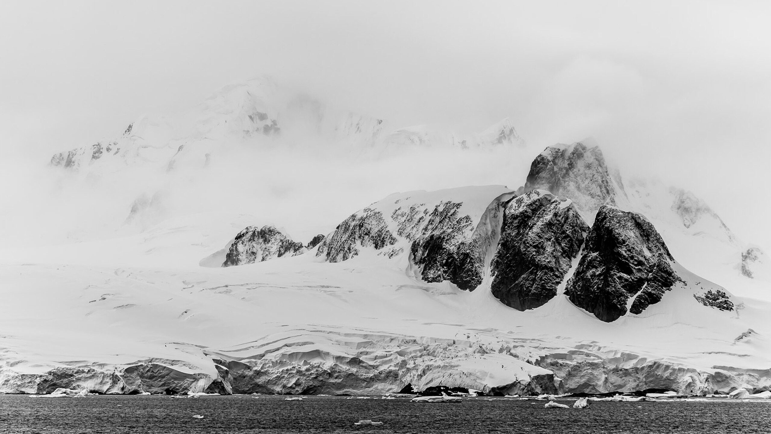 black and white Antarctic snowy rocks