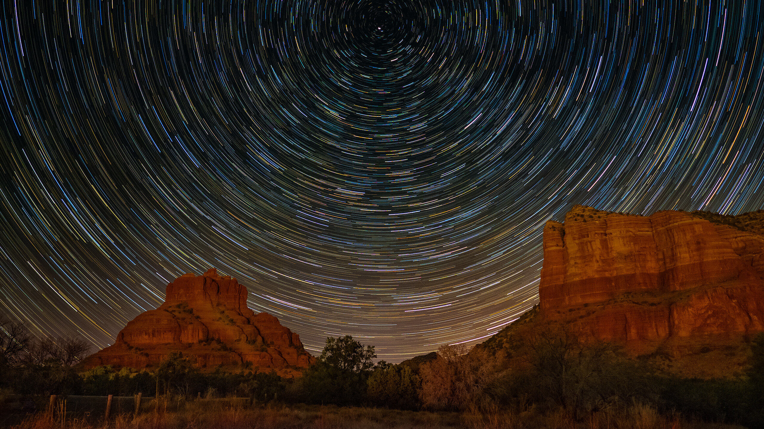 star trails and red rocks